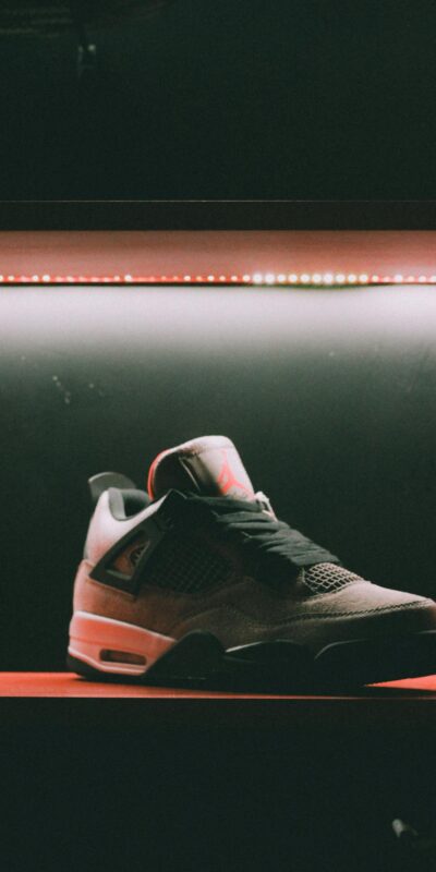 Close-up of a sneaker showcased in dramatic lighting in Muscat, Oman.