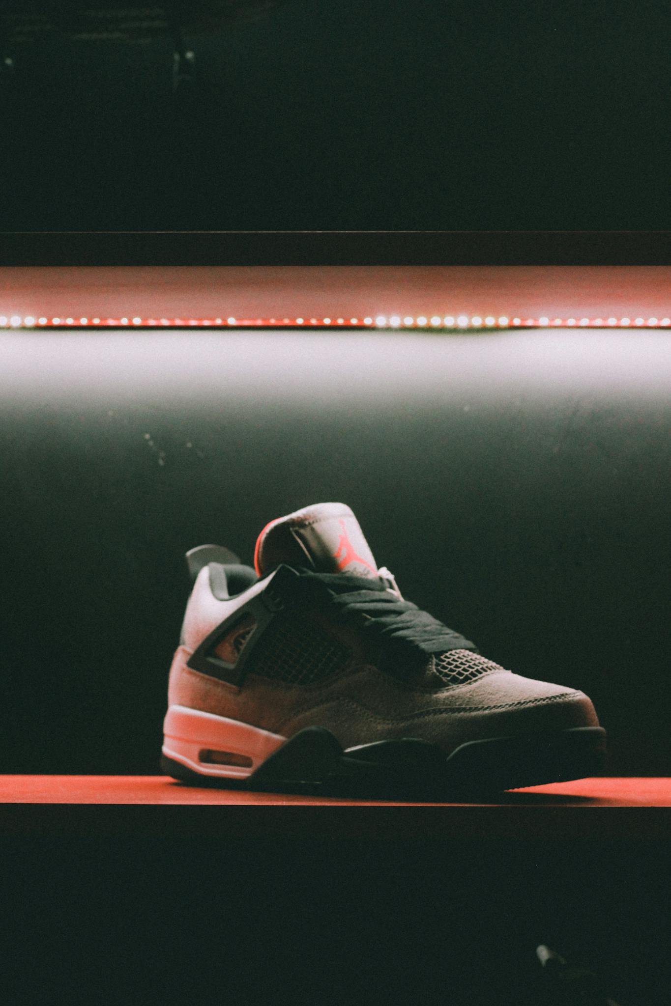 Close-up of a sneaker showcased in dramatic lighting in Muscat, Oman.