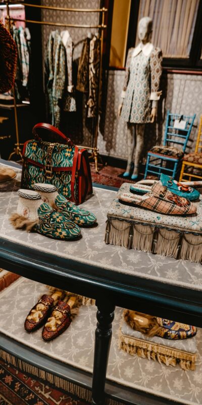 Elegant designer fashion display in a Florence boutique featuring stylish clothing and accessories.